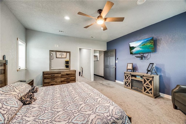 9414 Greenton Rd, Odessa, MO 64076 - bedroom featuring carpet flooring, a ceiling fan, a textured ceiling, and a textured wall