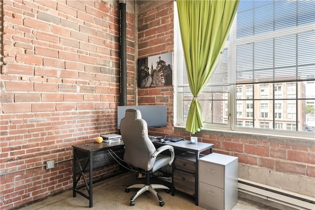 321 W 7th St Unit 501, Kansas City, MO 64105 - office area with a baseboard heating unit, brick wall, and healthy amount of natural light