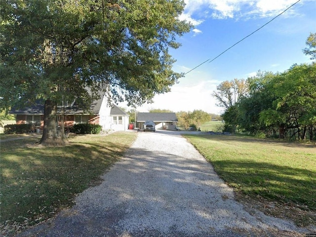 31212 E Webster Rd, Grain Valley, MO 64029 - view of front of home with driveway and a front lawn