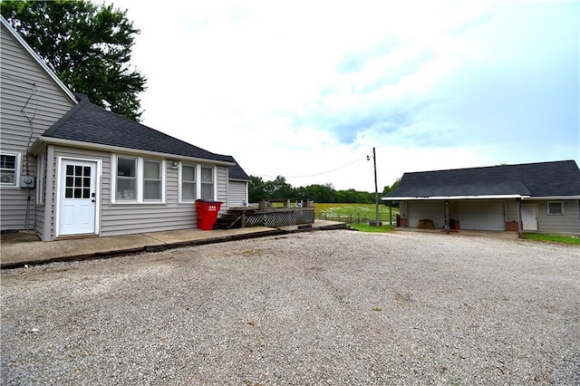 31212 E Webster Rd, Grain Valley, MO 64029 - view of side of home featuring driveway and a shingled roof