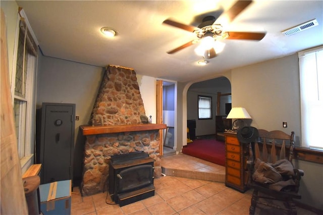 31212 E Webster Rd, Grain Valley, MO 64029 - living room featuring arched walkways, light tile patterned floors, ceiling fan, and plenty of natural light
