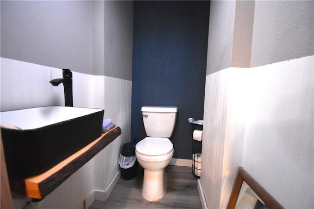 31212 E Webster Rd, Grain Valley, MO 64029 - bathroom featuring toilet and wood finished floors