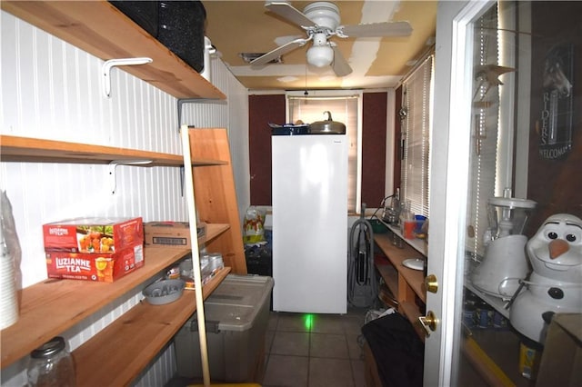 31212 E Webster Rd, Grain Valley, MO 64029 - kitchen with fridge, a ceiling fan, tile patterned floors, and an office area