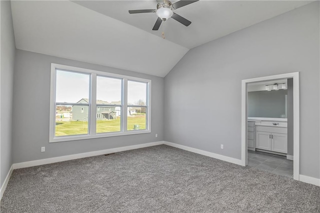 19787 W 114th Pl, Olathe, KS 66061 - unfurnished bedroom with carpet, vaulted ceiling, ensuite bath, and ceiling fan