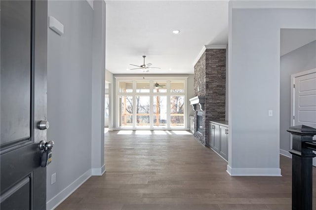 19499 W 114th Ter, Olathe, KS 66061 - foyer entrance with a ceiling fan, a stone fireplace, and wood finished floors