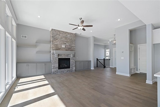 19499 W 114th Ter, Olathe, KS 66061 - unfurnished living room with a ceiling fan, wood finished floors, recessed lighting, and a fireplace