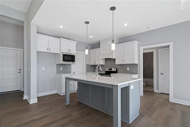 19499 W 114th Ter, Olathe, KS 66061 - kitchen featuring appliances with stainless steel finishes, backsplash, white cabinetry, light countertops, and recessed lighting