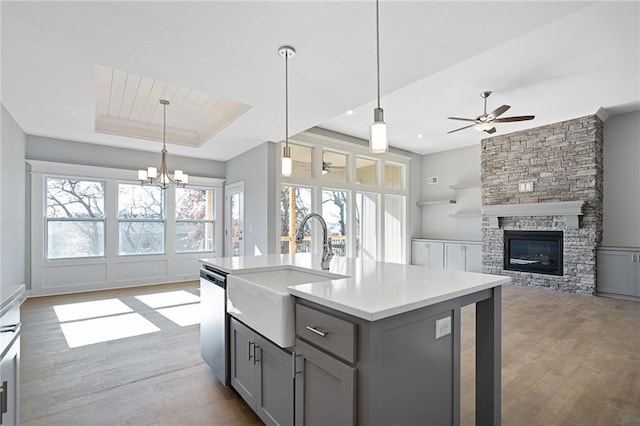 19499 W 114th Ter, Olathe, KS 66061 - kitchen featuring gray cabinetry, healthy amount of natural light, dishwasher, and light wood-type flooring