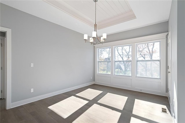 19499 W 114th Ter, Olathe, KS 66061 - unfurnished room featuring a chandelier, a tray ceiling, healthy amount of natural light, and wood finished floors