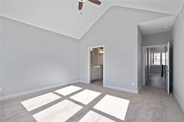 19499 W 114th Ter, Olathe, KS 66061 - unfurnished bedroom featuring light colored carpet, ensuite bathroom, high vaulted ceiling, and a ceiling fan