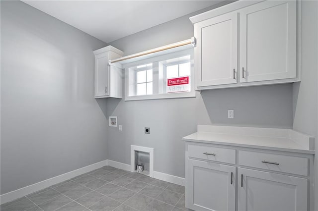 19499 W 114th Ter, Olathe, KS 66061 - laundry area featuring electric dryer hookup, hookup for a washing machine, cabinet space, and light tile patterned floors