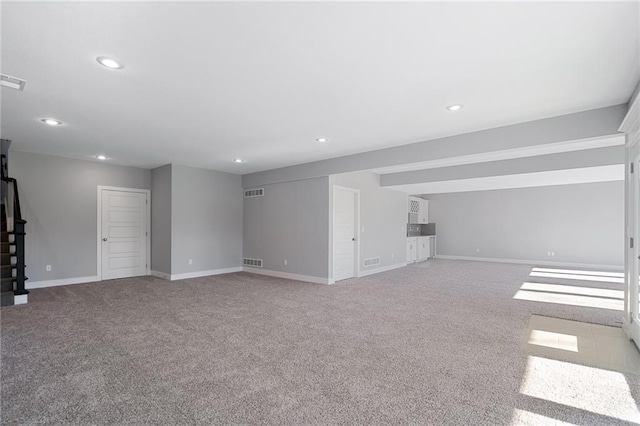 19499 W 114th Ter, Olathe, KS 66061 - unfurnished living room featuring carpet and recessed lighting