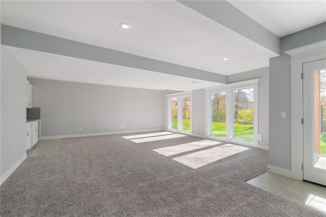 19499 W 114th Ter, Olathe, KS 66061 - unfurnished living room featuring light colored carpet, recessed lighting, and light tile patterned floors