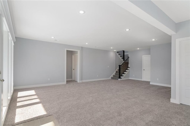 19499 W 114th Ter, Olathe, KS 66061 - below grade area featuring light colored carpet, stairs, and recessed lighting