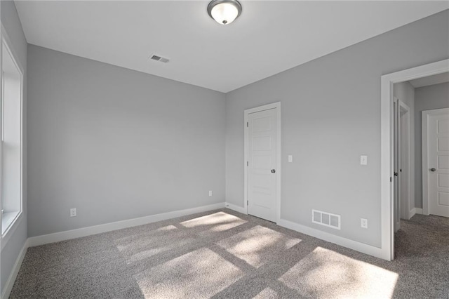 19499 W 114th Ter, Olathe, KS 66061 - empty room with carpet floors and baseboards