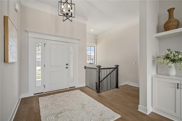 19499 W 114th Ter, Olathe, KS 66061 - foyer featuring crown molding, dark wood-type flooring, and a chandelier