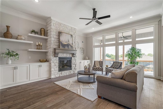 19499 W 114th Ter, Olathe, KS 66061 - living area featuring a ceiling fan, ornamental molding, wood finished floors, a fireplace, and recessed lighting