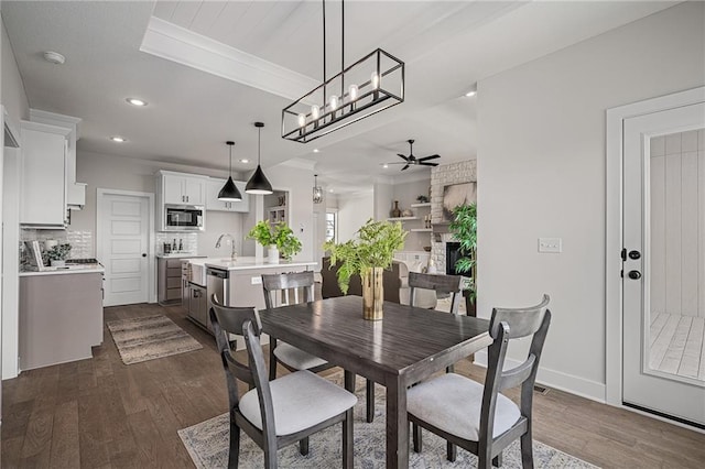 19499 W 114th Ter, Olathe, KS 66061 - dining space featuring dark wood-style floors, a ceiling fan, recessed lighting, and ornamental molding