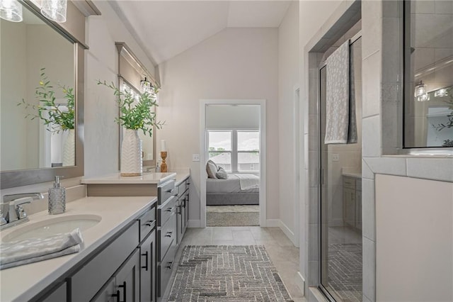 19499 W 114th Ter, Olathe, KS 66061 - ensuite bathroom featuring vaulted ceiling, vanity, a stall shower, and tile patterned floors