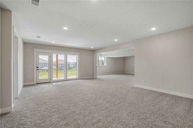 19499 W 114th Ter, Olathe, KS 66061 - spare room with light carpet, a textured ceiling, and recessed lighting