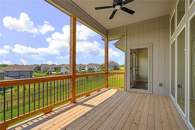19499 W 114th Ter, Olathe, KS 66061 - wooden deck with a residential view, ceiling fan, and a yard