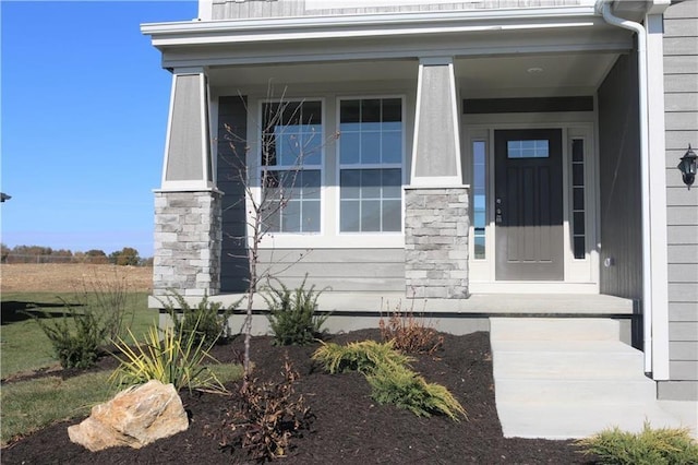 19444 W 114th Ter, Olathe, KS 66061 - property entrance with covered porch and stone siding