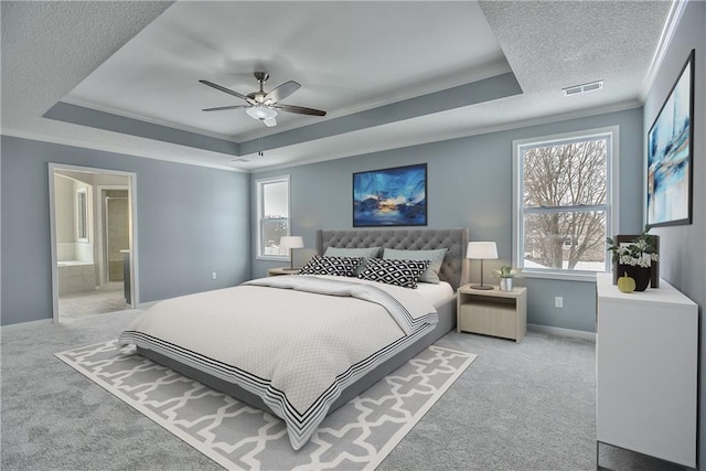 19444 W 114th Ter, Olathe, KS 66061 - bedroom with a tray ceiling, light carpet, crown molding, a textured ceiling, and ensuite bathroom