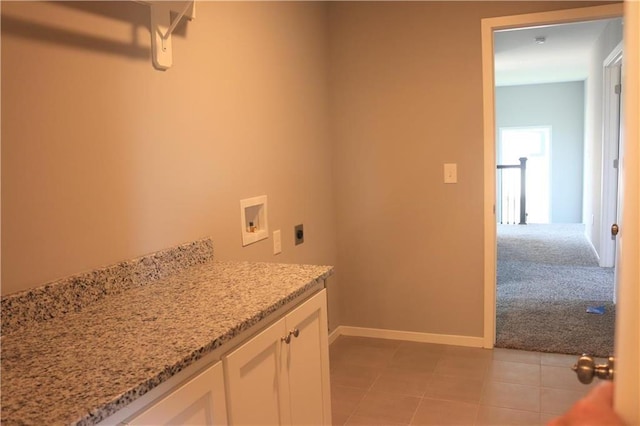 19444 W 114th Ter, Olathe, KS 66061 - laundry area featuring electric dryer hookup, washer hookup, light tile patterned floors, light colored carpet, and cabinet space
