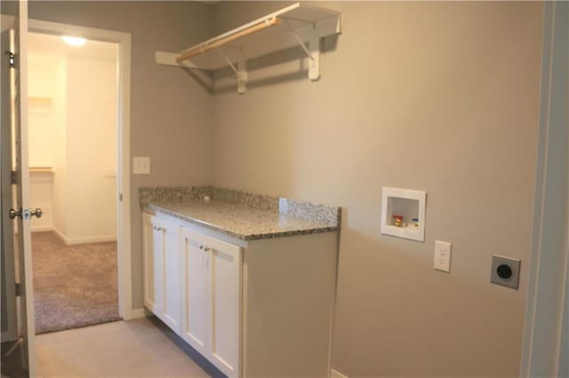 19444 W 114th Ter, Olathe, KS 66061 - laundry area with hookup for an electric dryer, hookup for a washing machine, cabinet space, light carpet, and light tile patterned floors