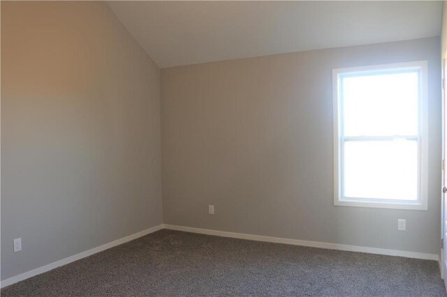 19444 W 114th Ter, Olathe, KS 66061 - unfurnished room with dark carpet and lofted ceiling