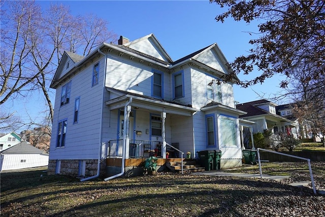 1101 S Broadway St, Leavenworth, KS 66048 - view of front of property with a porch and a chimney