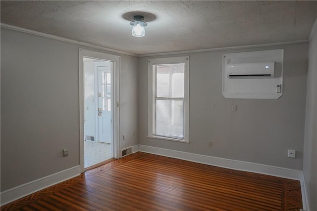 1101 S Broadway St, Leavenworth, KS 66048 - empty room with wood finished floors, crown molding, and a wall unit AC
