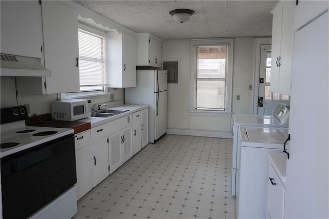 1101 S Broadway St, Leavenworth, KS 66048 - kitchen with white appliances, custom range hood, white cabinets, and light flooring