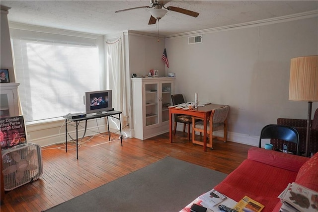 1101 S Broadway St, Leavenworth, KS 66048 - living room featuring a ceiling fan, an office area, hardwood / wood-style floors, and ornamental molding
