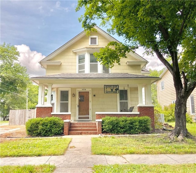 406 S 6th St, Burlington, KS 66839 - view of front of house with a porch and brick siding