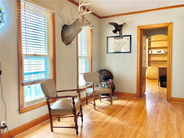 406 S 6th St, Burlington, KS 66839 - living area with ornamental molding, light wood-style floors, and built in features