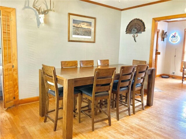 406 S 6th St, Burlington, KS 66839 - dining room with light wood-style flooring and crown molding