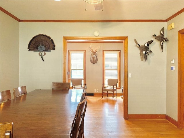 406 S 6th St, Burlington, KS 66839 - dining area featuring crown molding and light wood finished floors