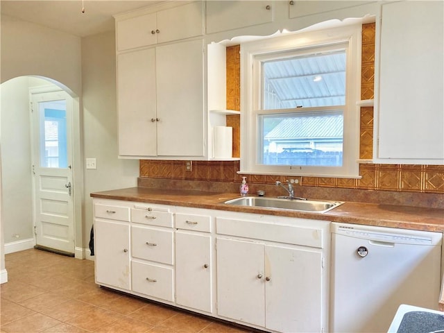 406 S 6th St, Burlington, KS 66839 - kitchen featuring dishwasher, arched walkways, decorative backsplash, and plenty of natural light