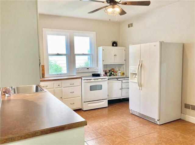 406 S 6th St, Burlington, KS 66839 - kitchen with white appliances, a ceiling fan, white cabinetry, and light tile patterned flooring