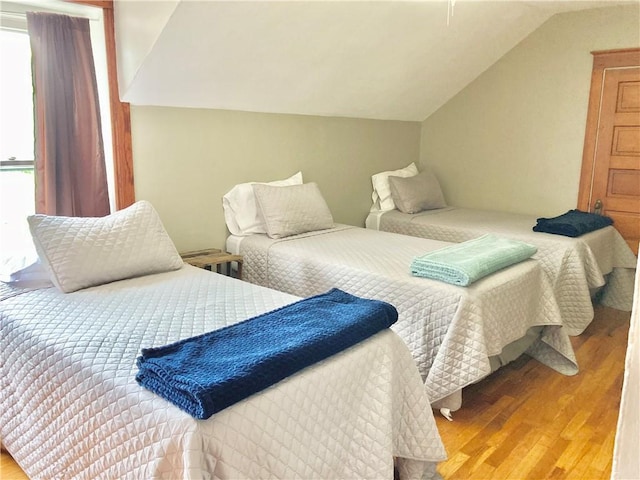 406 S 6th St, Burlington, KS 66839 - bedroom featuring wood finished floors and lofted ceiling