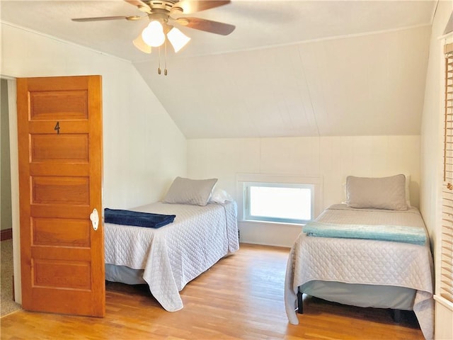 406 S 6th St, Burlington, KS 66839 - bedroom with light wood finished floors, vaulted ceiling, and ceiling fan