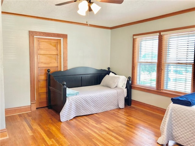 406 S 6th St, Burlington, KS 66839 - bedroom with light wood finished floors, crown molding, and ceiling fan