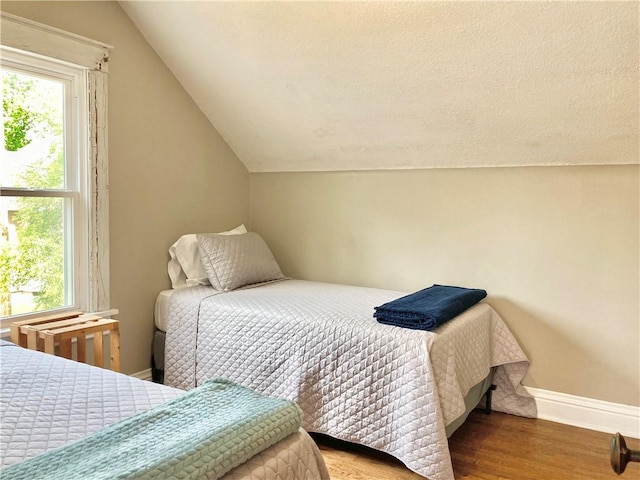 406 S 6th St, Burlington, KS 66839 - bedroom featuring lofted ceiling and wood finished floors
