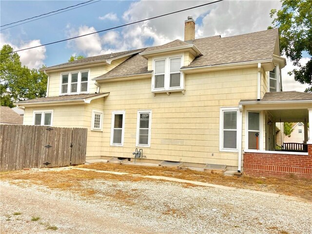 406 S 6th St, Burlington, KS 66839 - view of side of home with a chimney and a shingled roof