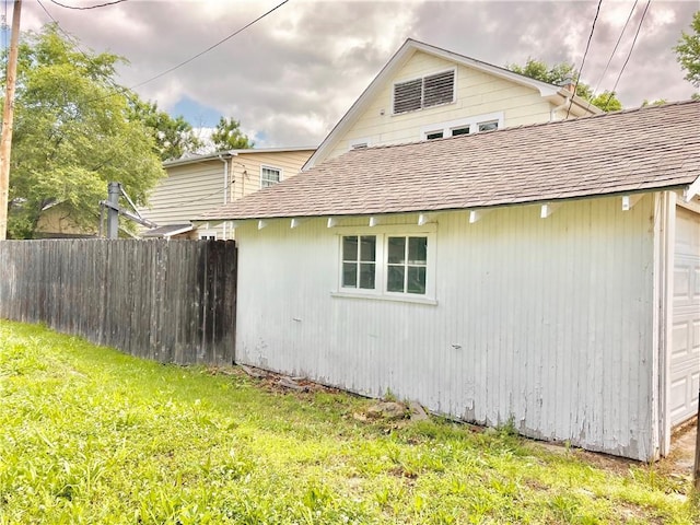 406 S 6th St, Burlington, KS 66839 - view of side of property with a garage and a shingled roof