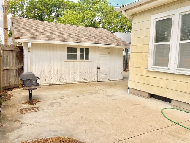 406 S 6th St, Burlington, KS 66839 - entrance to property with a patio and roof with shingles