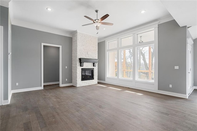19455 W 114th Ter, Olathe, KS 66061 - unfurnished living room with ceiling fan, ornamental molding, wood finished floors, a fireplace, and recessed lighting