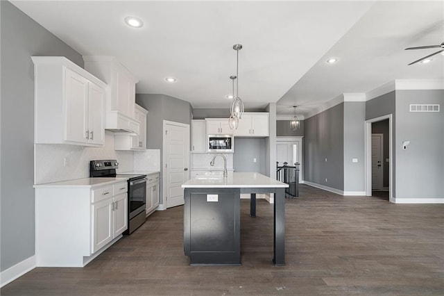 19455 W 114th Ter, Olathe, KS 66061 - kitchen featuring stainless steel range with electric cooktop, white cabinets, backsplash, and recessed lighting