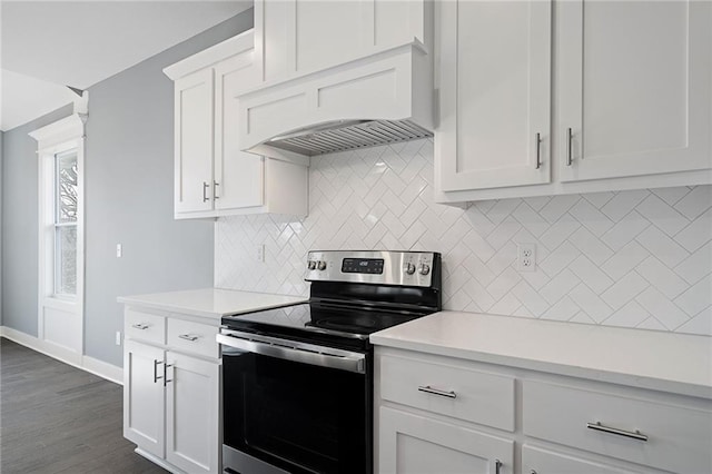 19455 W 114th Ter, Olathe, KS 66061 - kitchen featuring stainless steel range with electric cooktop, light countertops, decorative backsplash, and custom range hood